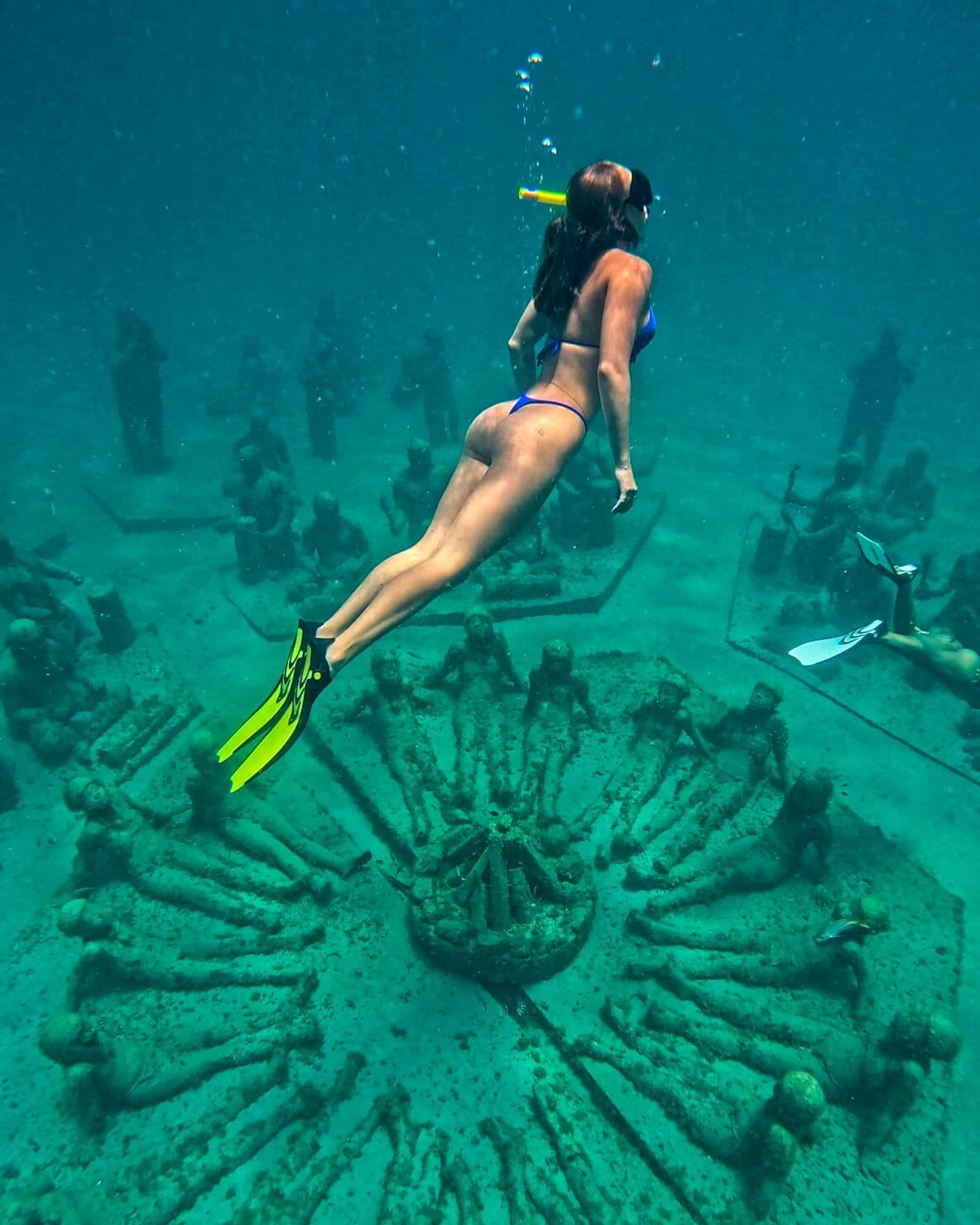 Snorkeler exploring the award-winning Under SXM underwater sculpture park